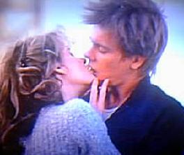 Kevin Bacon & Lori Singer embrace